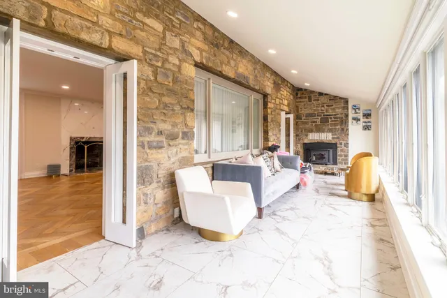 a bathroom with a tub sink and window