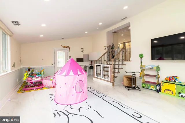 a kitchen with a stove a sink and a refrigerator