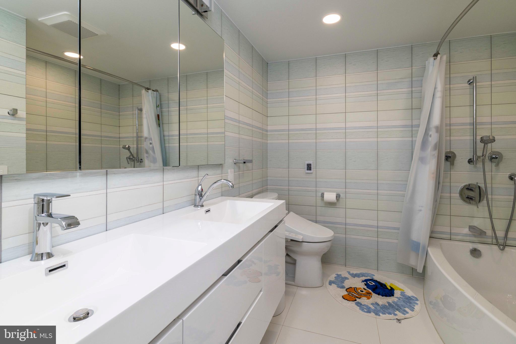 1851 Meetinghouse Road Warminster, PA 18974 - Photo 29 of 66 a bathroom with a double vanity sink toilet and shower