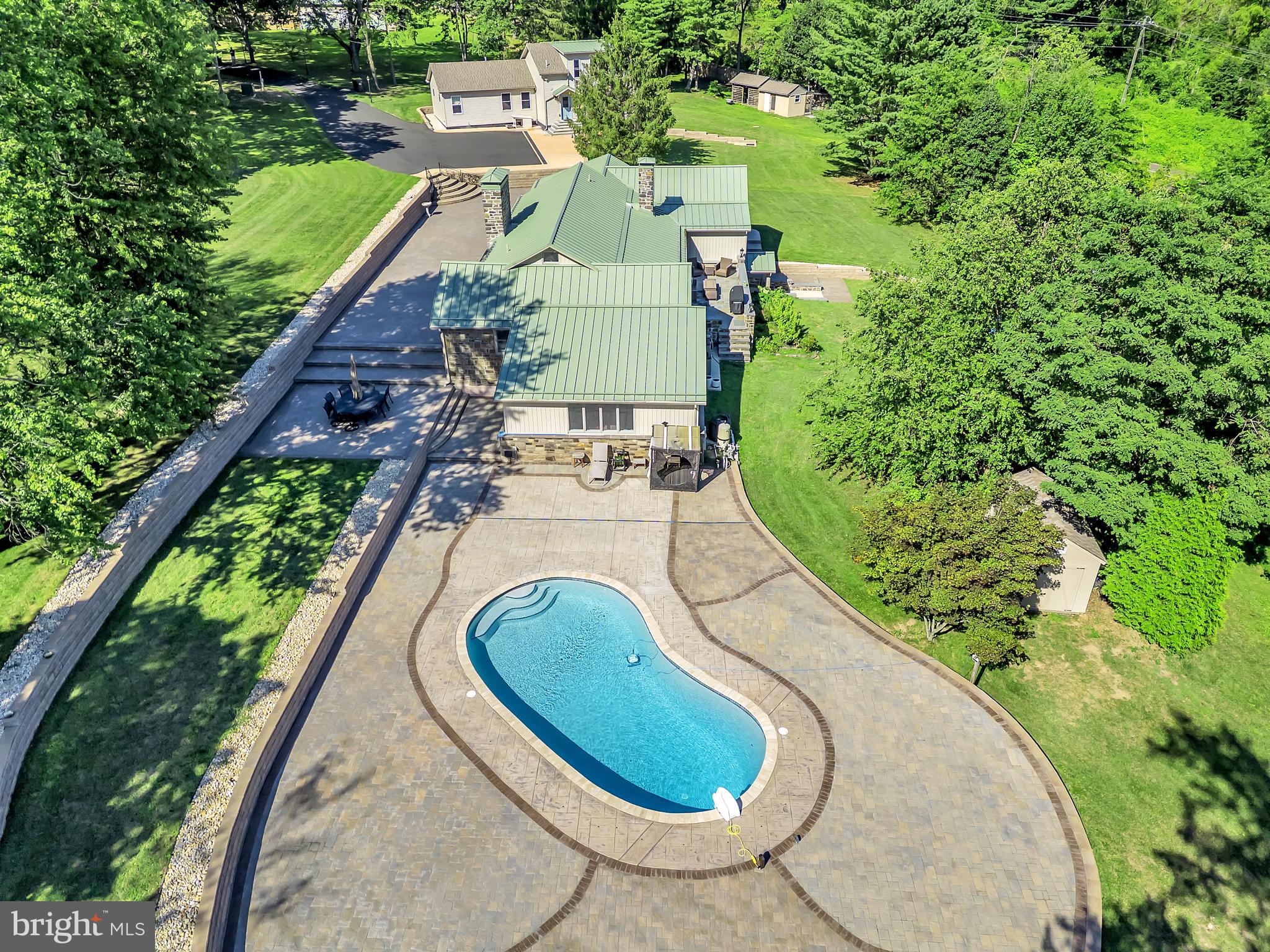 1851 Meetinghouse Road Warminster, PA 18974 - Photo 3 of 66 an aerial view of a house with a garden and trees