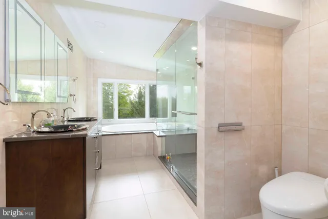 a bathroom with a bathtub and a shower