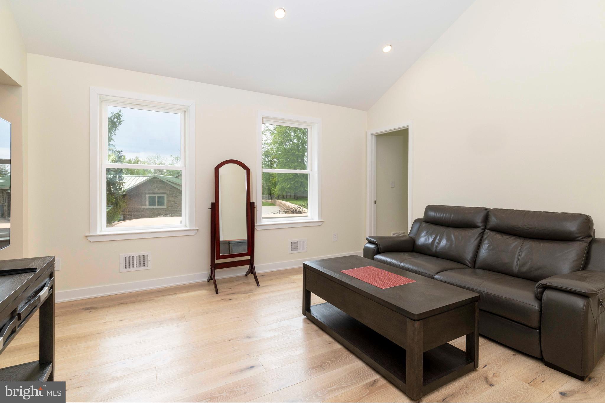 1851 Meetinghouse Road Warminster, PA 18974 - Photo 38 of 66 a living room with furniture and a window