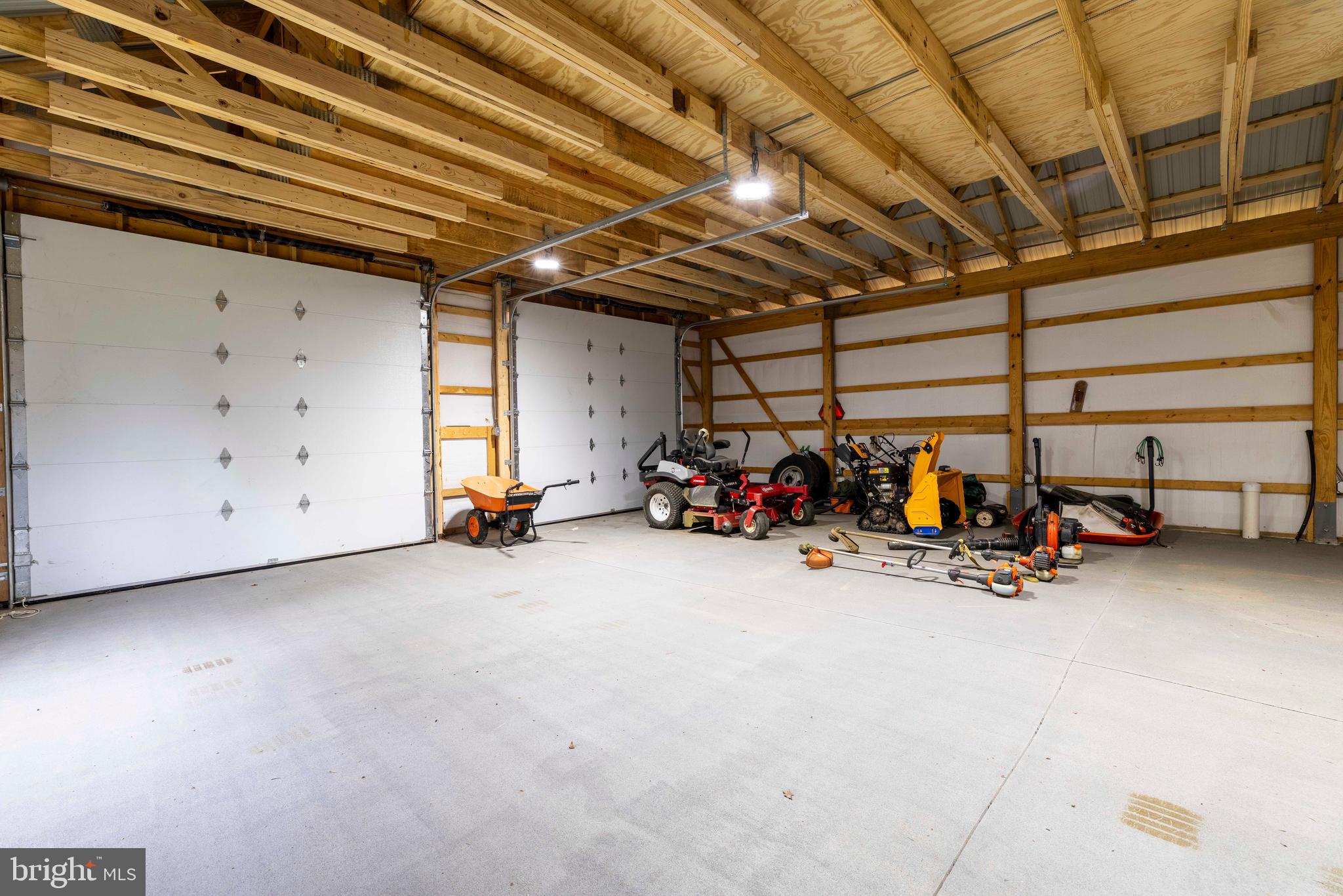 1851 Meetinghouse Road Warminster, PA 18974 - Photo 41 of 66 a view of a garage with a bike and car
