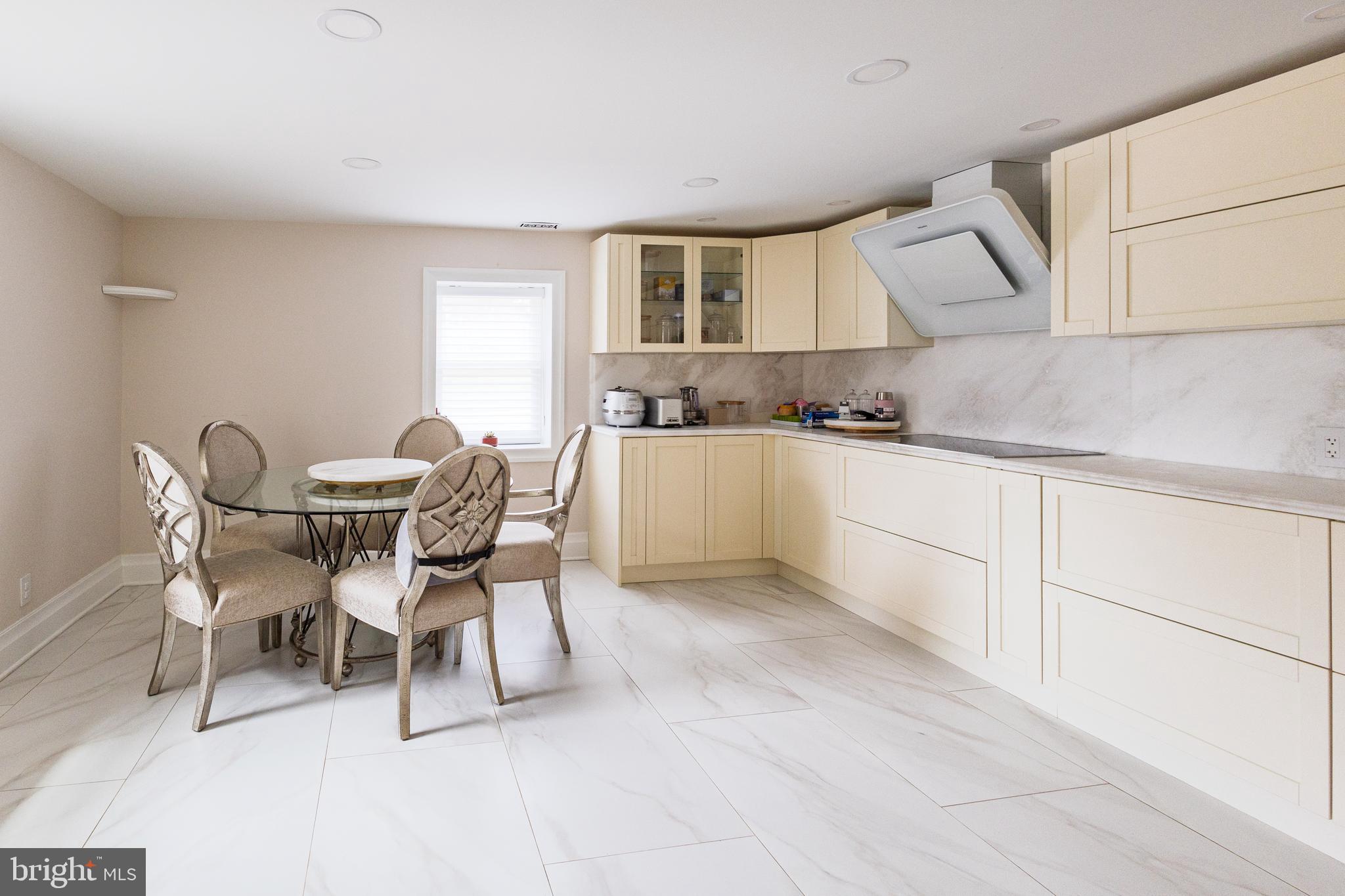 1851 Meetinghouse Road Warminster, PA 18974 - Photo 65 of 66 a kitchen with granite countertop a sink and white cabinets