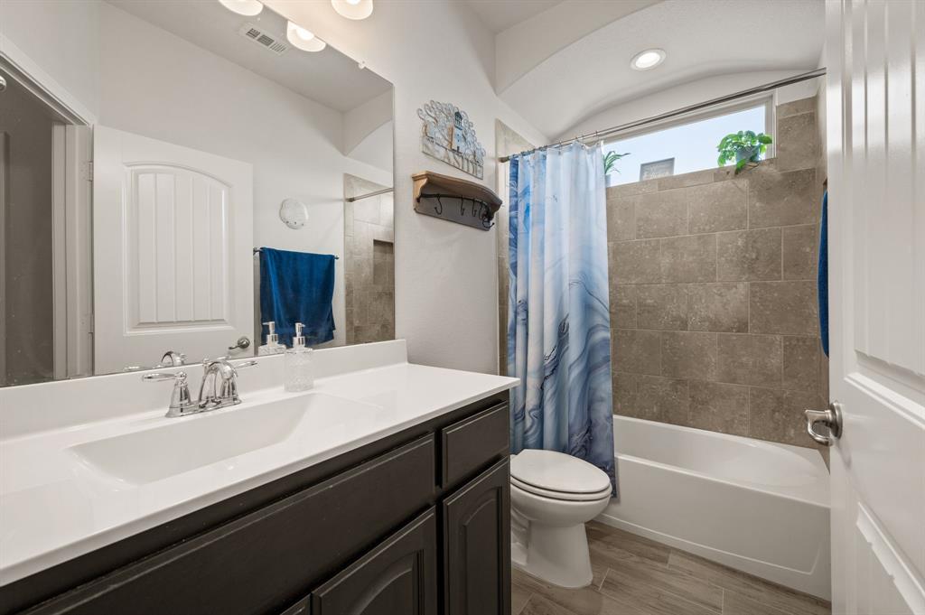 15817 White Mill Road Fort Worth, TX 76177 - Photo 17 of 27 a bathroom with a sink a toilet and shower