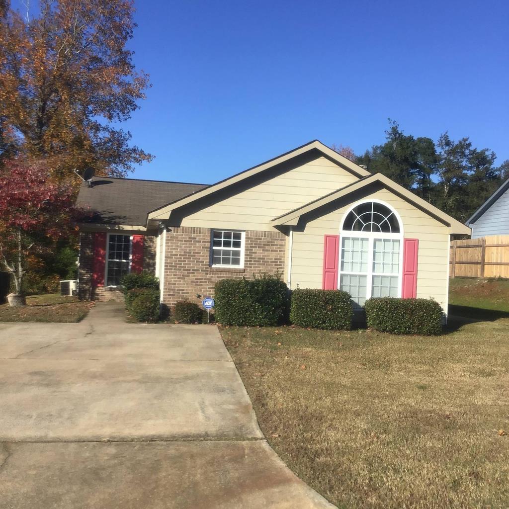 a front view of a house with a yard