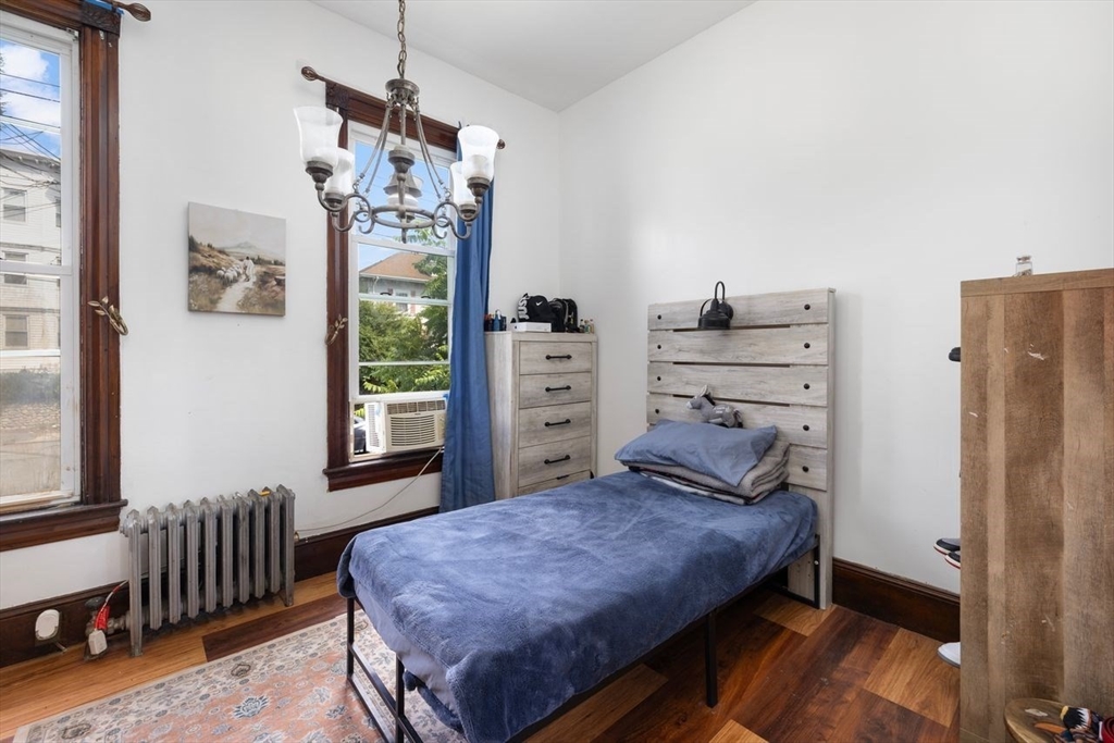 311 Elm Street Woonsocket, RI 02895 - Photo 21 of 29 a bedroom with a bed and a window