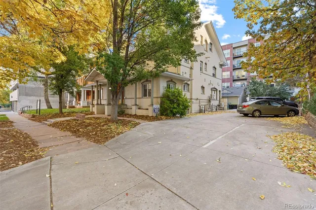 a building with trees covered by side of it