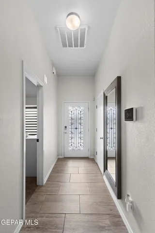 a view of a hallway with windows