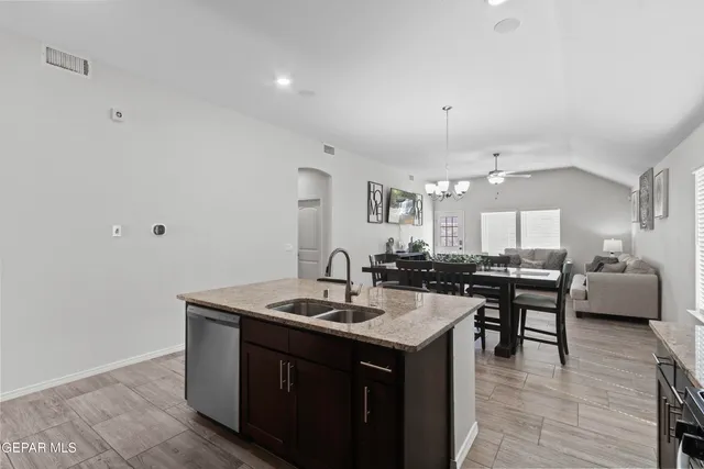 a kitchen with a sink and cabinets