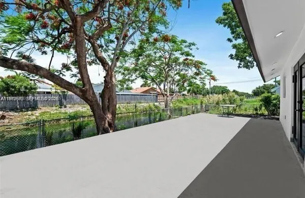 a view of a house with a tree in a yard