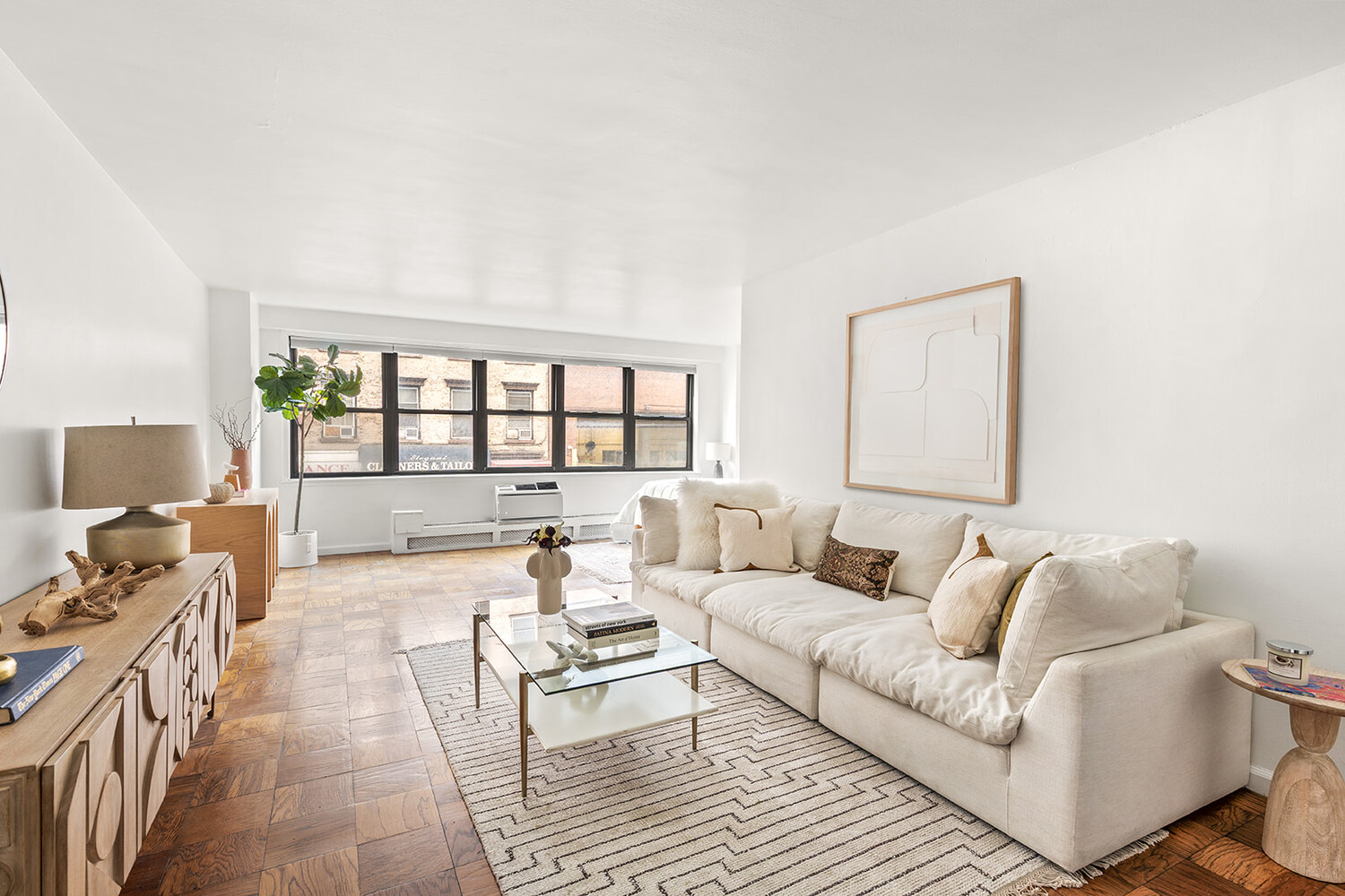 a living room with furniture and a window