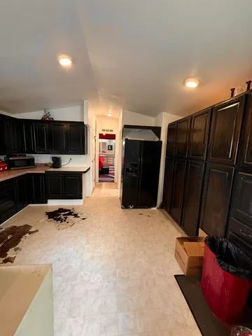 a kitchen with stainless steel appliances a refrigerator and a sink