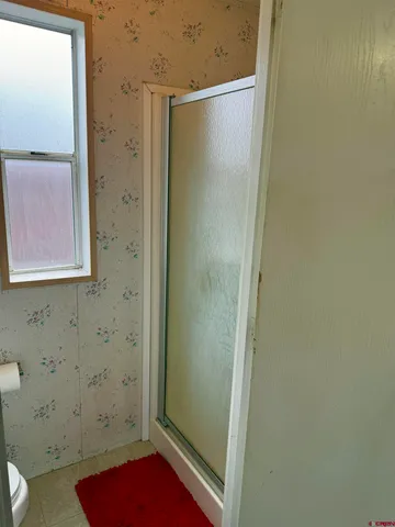 view of bathroom with a shower and a sink