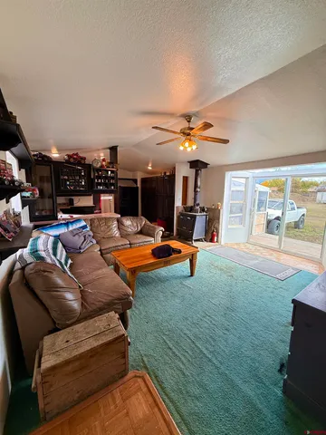 a living room with furniture and a table