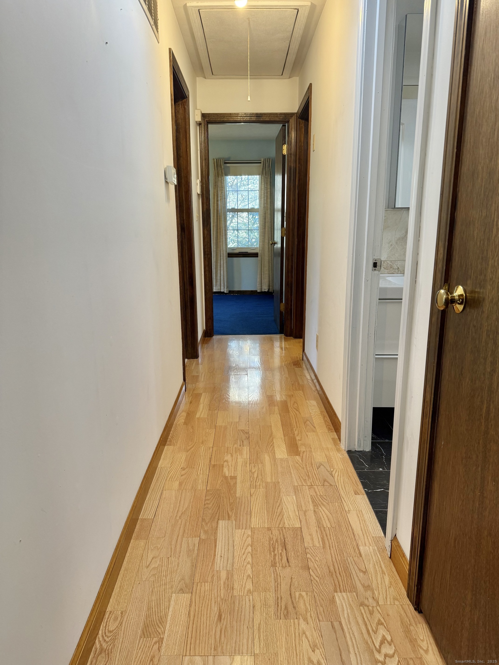 12 Great Meadow Road Seymour, CT 06483 - Photo 22 of 33 a view of a hallway with wooden floor and a bathroom