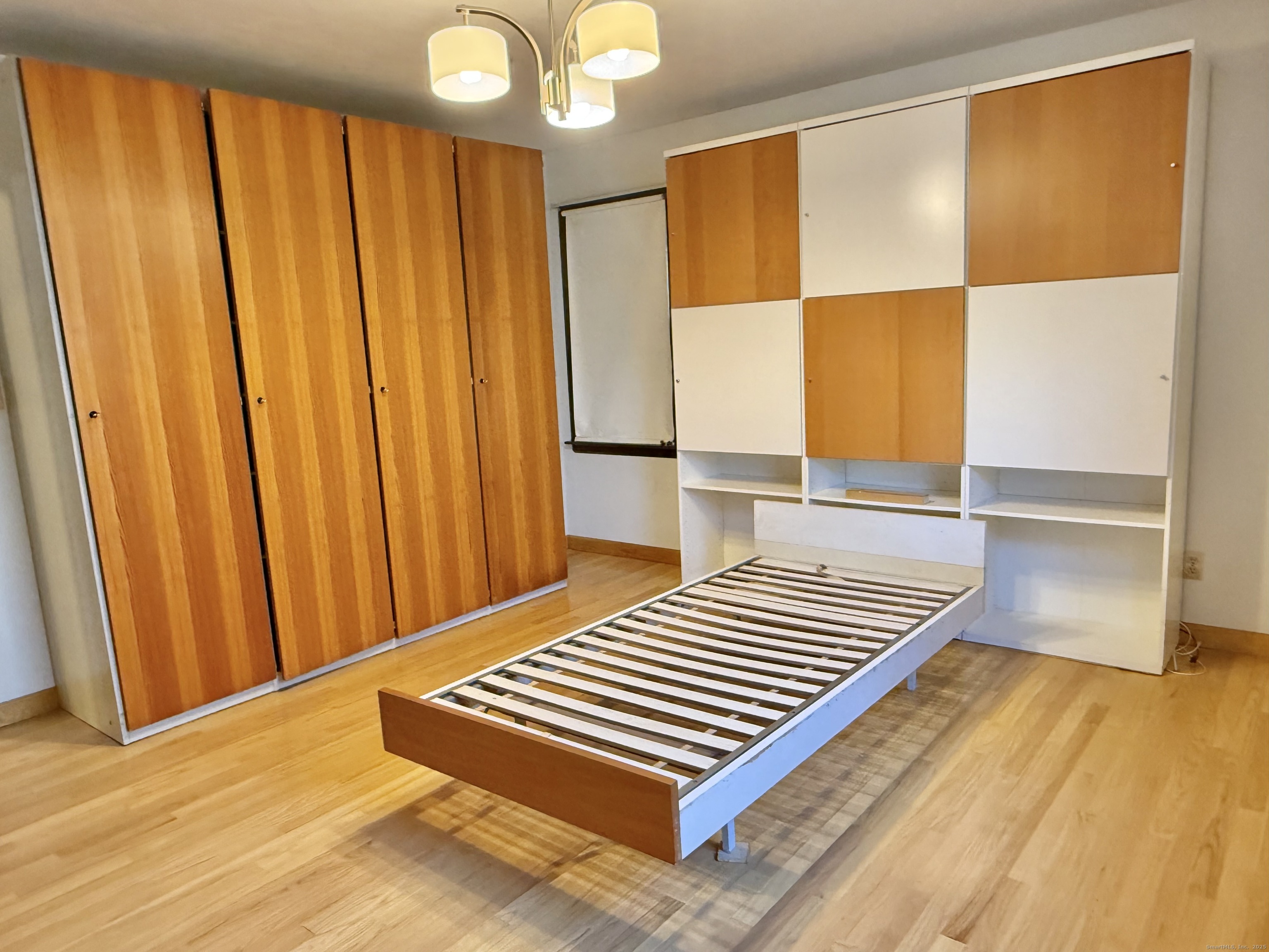 12 Great Meadow Road Seymour, CT 06483 - Photo 27 of 33 a view of a bedroom with wooden floor and bathroom