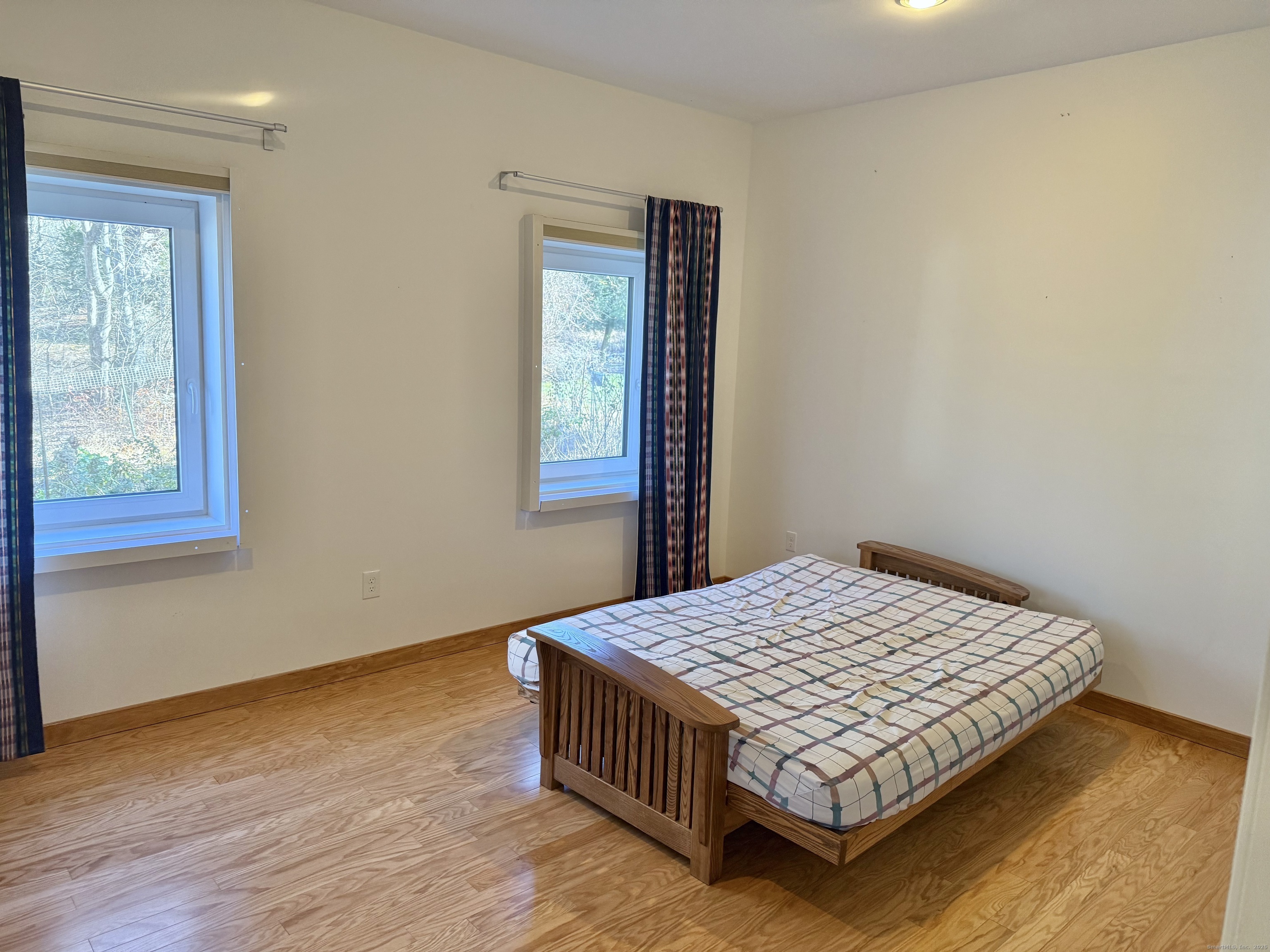 12 Great Meadow Road Seymour, CT 06483 - Photo 29 of 33 a bedroom with a bed window and wooden floor
