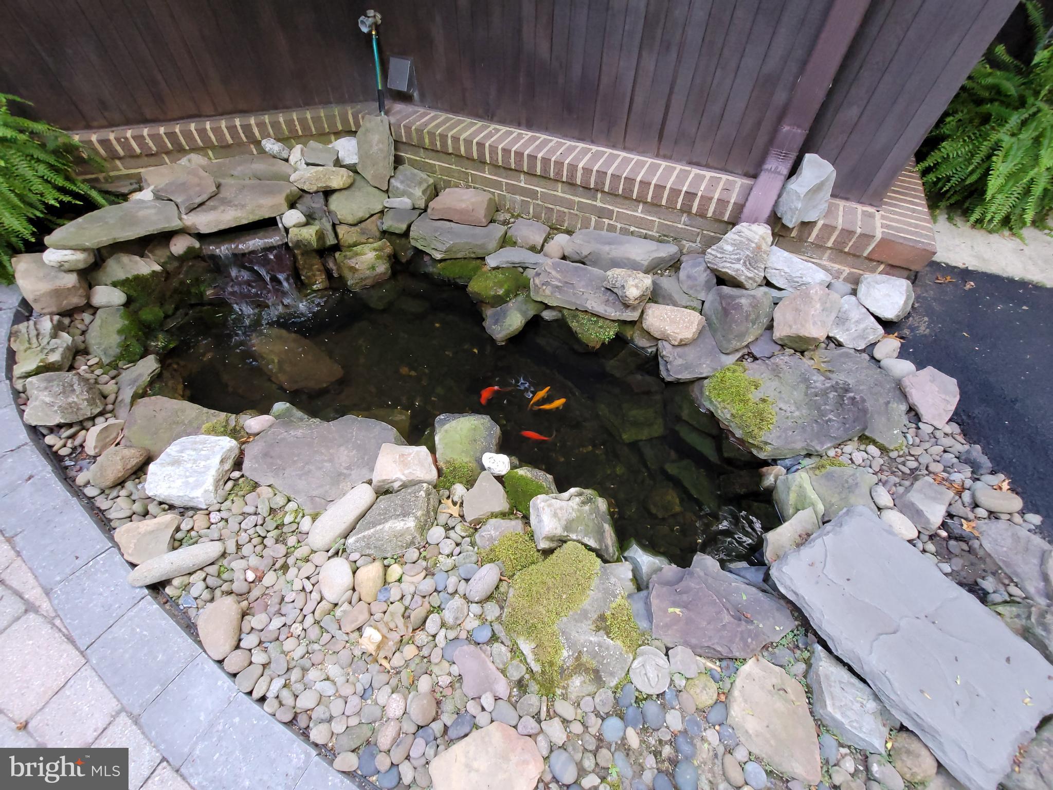 686 Discovery Road Davidsonville, MD 21035 - Photo 55 of 74 Enjoy the Koi pond by the front door entrance.