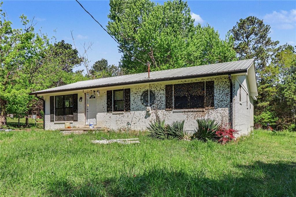 123 Baker Circle Southeast Calhoun, GA 30701 - Photo 2 of 15 a front view of house with yard and green space