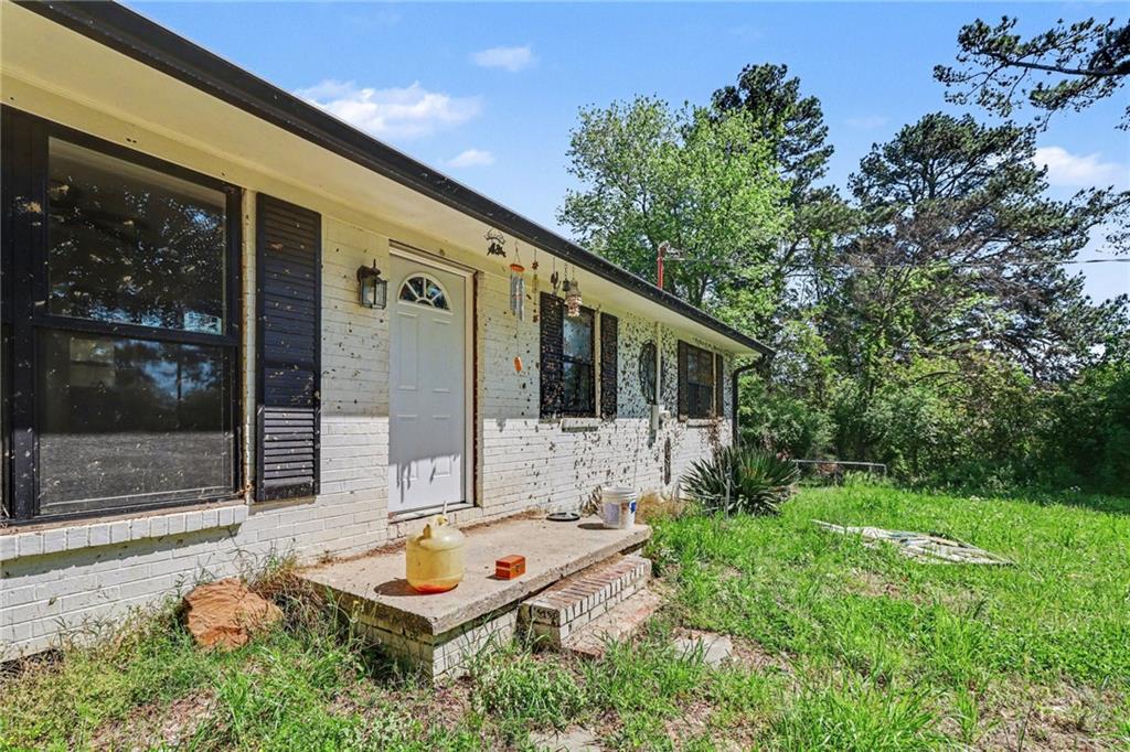 123 Baker Circle Southeast Calhoun, GA 30701 - Photo 4 of 15 a backyard of a house with yard and outdoor seating