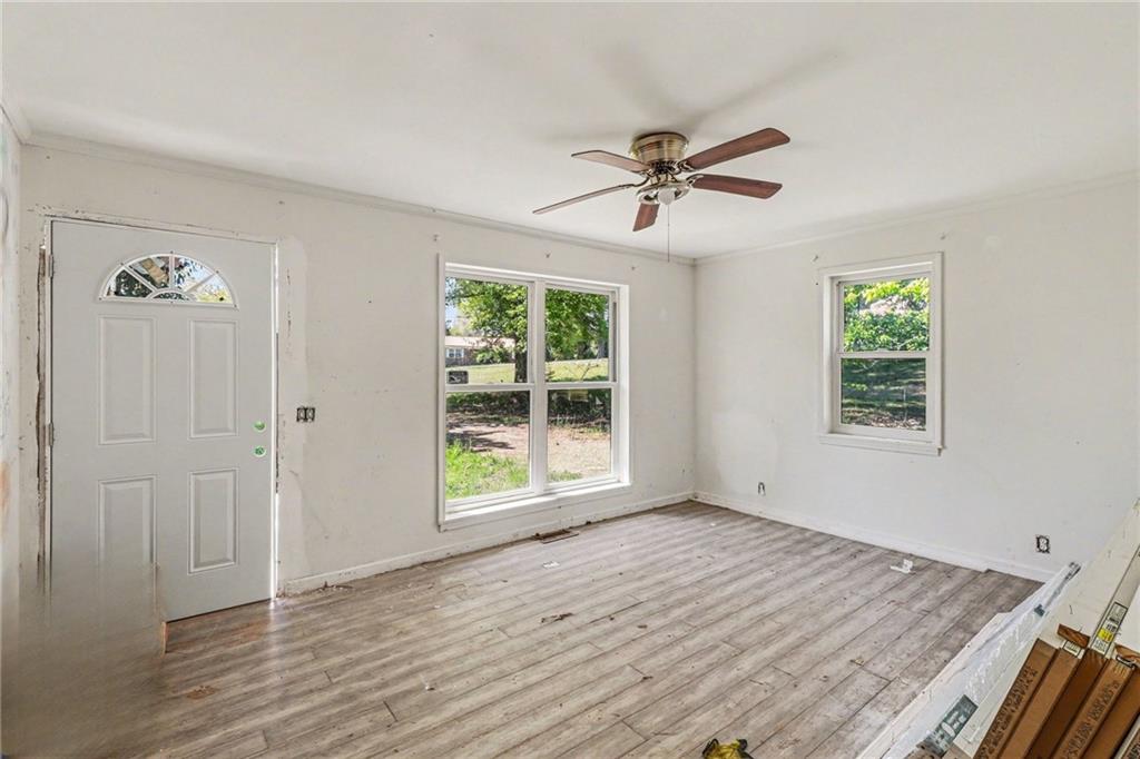 123 Baker Circle Southeast Calhoun, GA 30701 - Photo 5 of 15 a view of empty room with wooden floor and fan