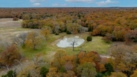 an aerial view of a houses with beach