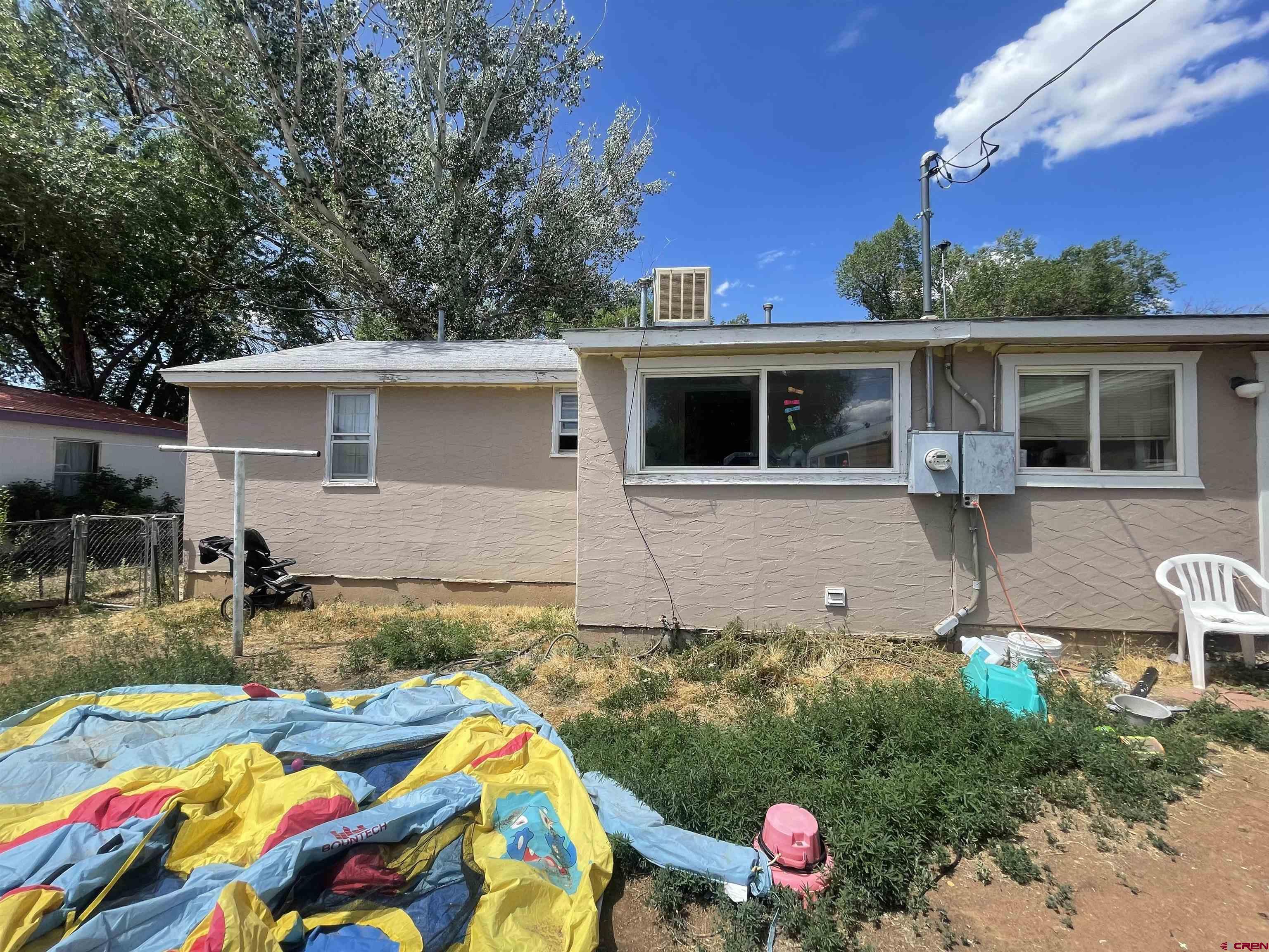 777 Stratton Drive Cortez, CO 81321 - Photo 12 of 16 a front view of house with yard and outdoor seating