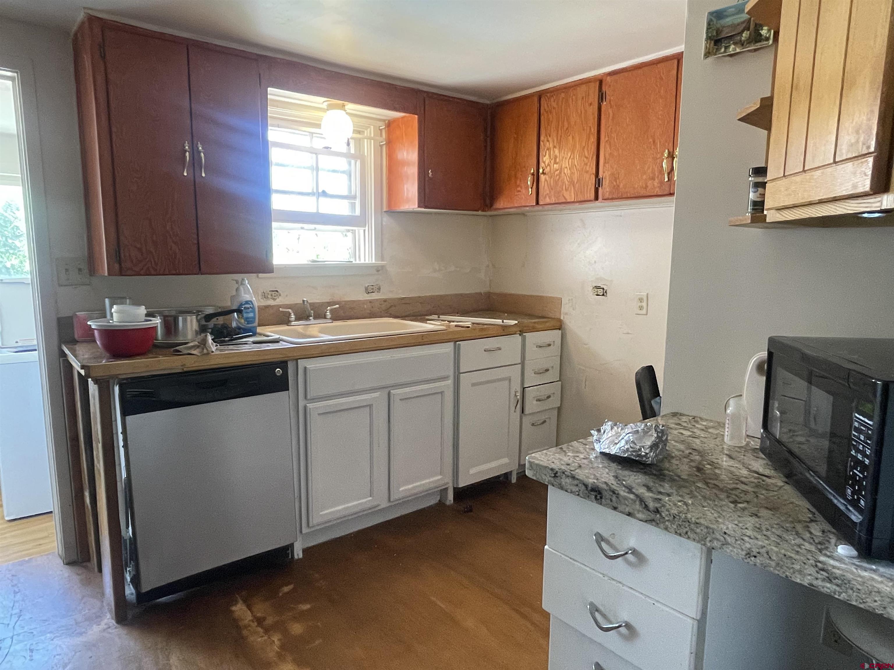 777 Stratton Drive Cortez, CO 81321 - Photo 2 of 16 a kitchen with a sink cabinets and window