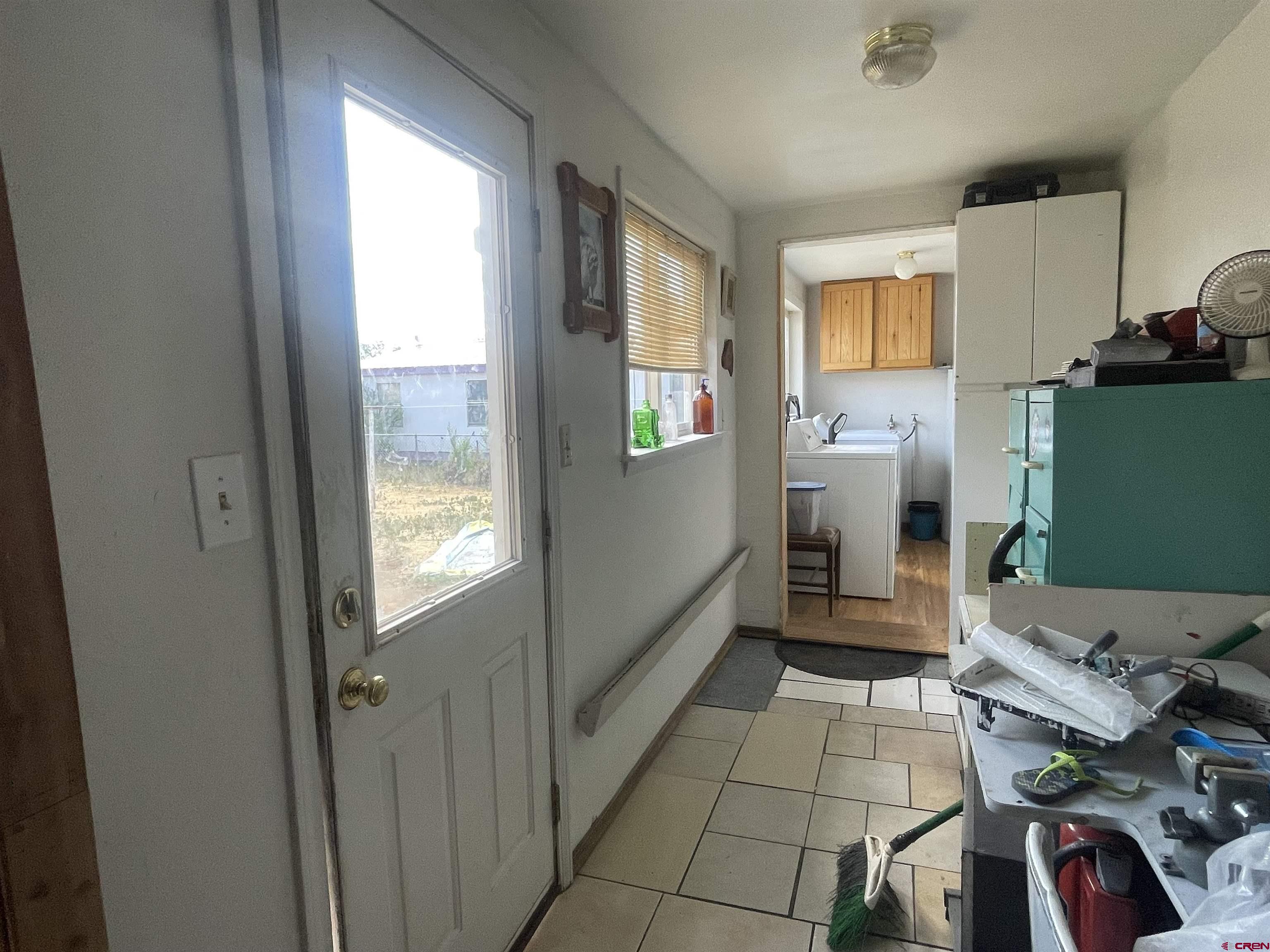 777 Stratton Drive Cortez, CO 81321 - Photo 7 of 16 a room with furniture a flat screen tv and a window