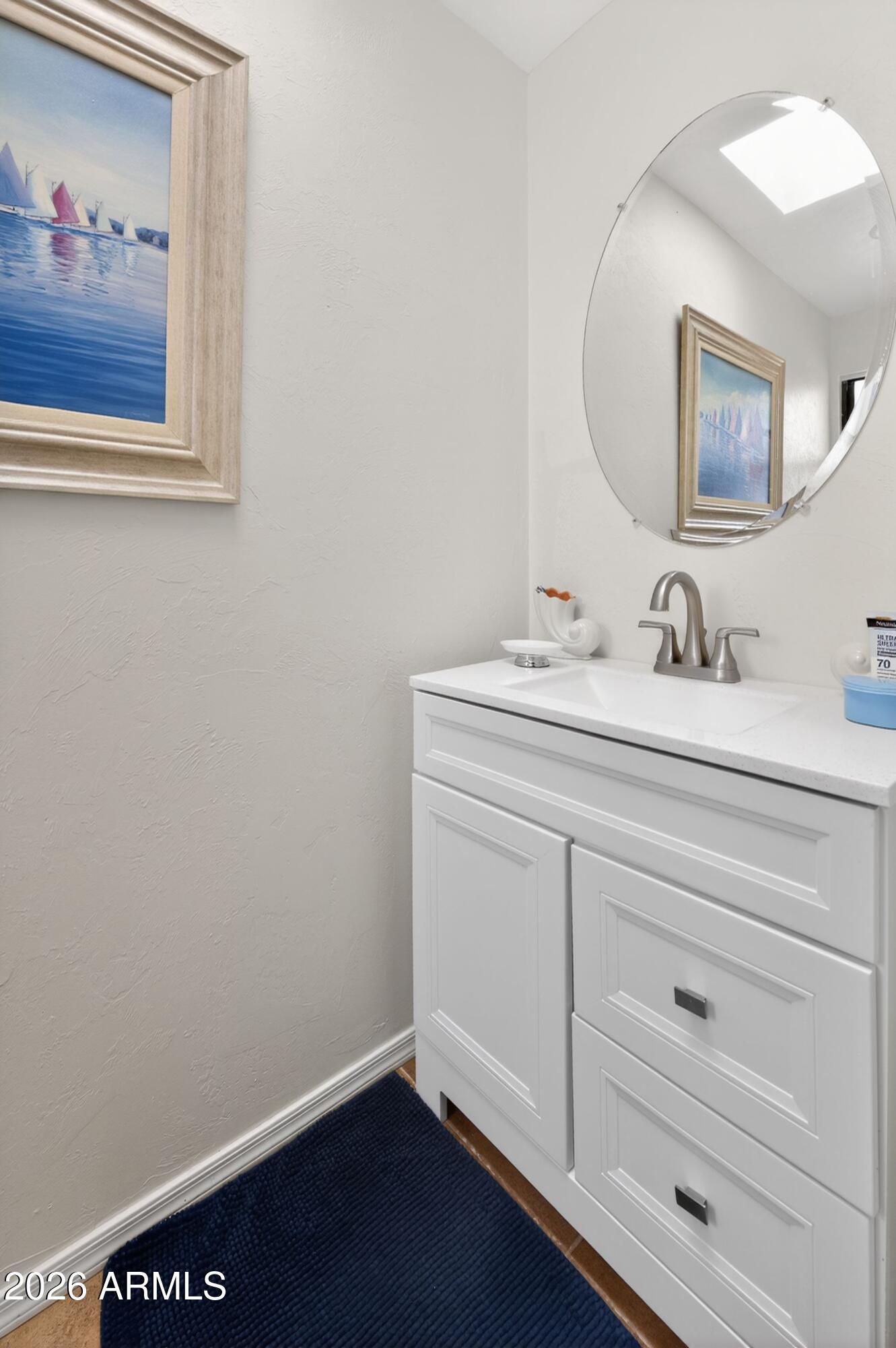 277 Círculo Silva Rio Rico, AZ 85648 - Photo 23 of 34 a bathroom with a sink and a mirror