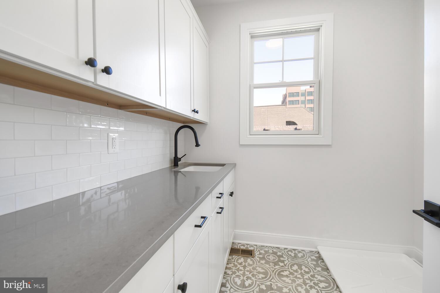 7819 Exeter Road Bethesda, MD 20814 - Photo 24 of 38 Upstairs Laundry Room