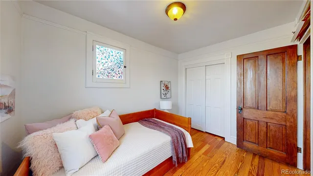 a bed room with a bed and a window