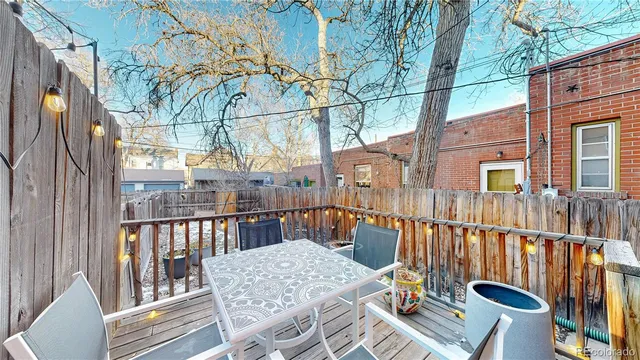 a view of a balcony with a table and chairs
