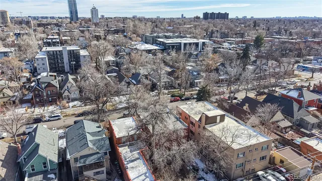 an aerial view of a city with lots of residential buildings