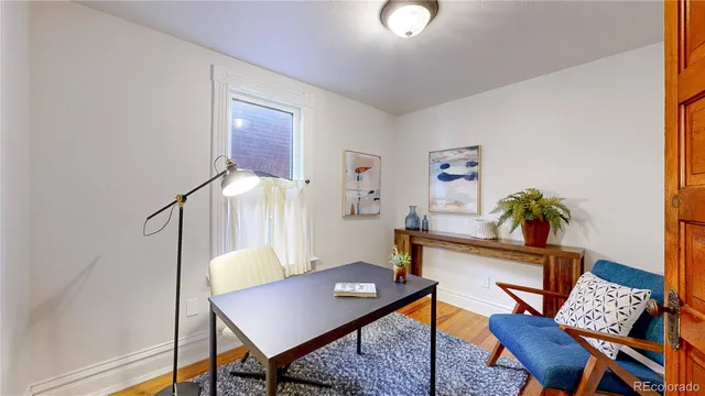 a workspace with furniture and wooden floor