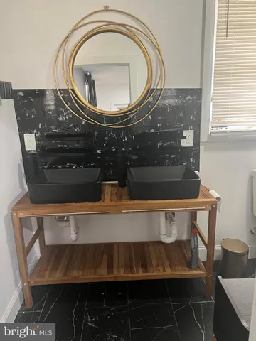 a bathroom with a toilet and a sink