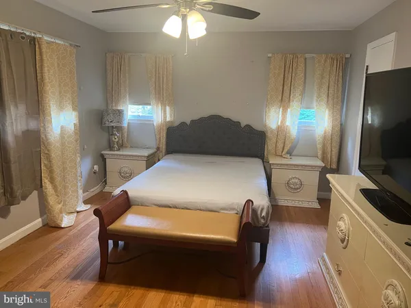 a bed room with a bed and a television