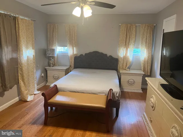 a bed room with a bed and a television