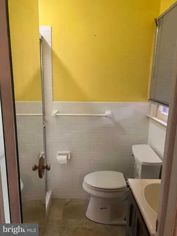a bathroom with a toilet and a sink