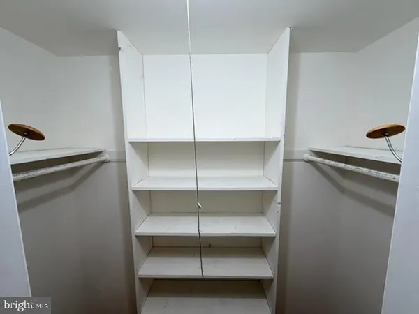 a view of an empty walk in closet
