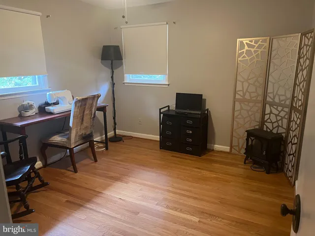 a view of an empty room with a cabinet