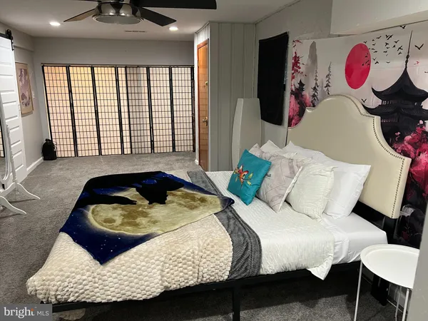 a bedroom with a bed and window