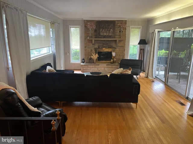 a bed sitting in a room next to a window