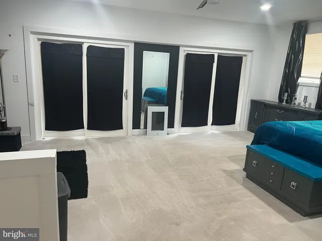 a living room with a couch and a dresser