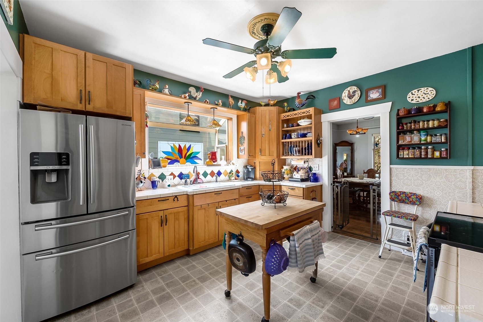 222 Wells Avenue North Renton, WA 98057 - Photo 12 of 23 a kitchen with stainless steel appliances granite countertop a refrigerator and a sink