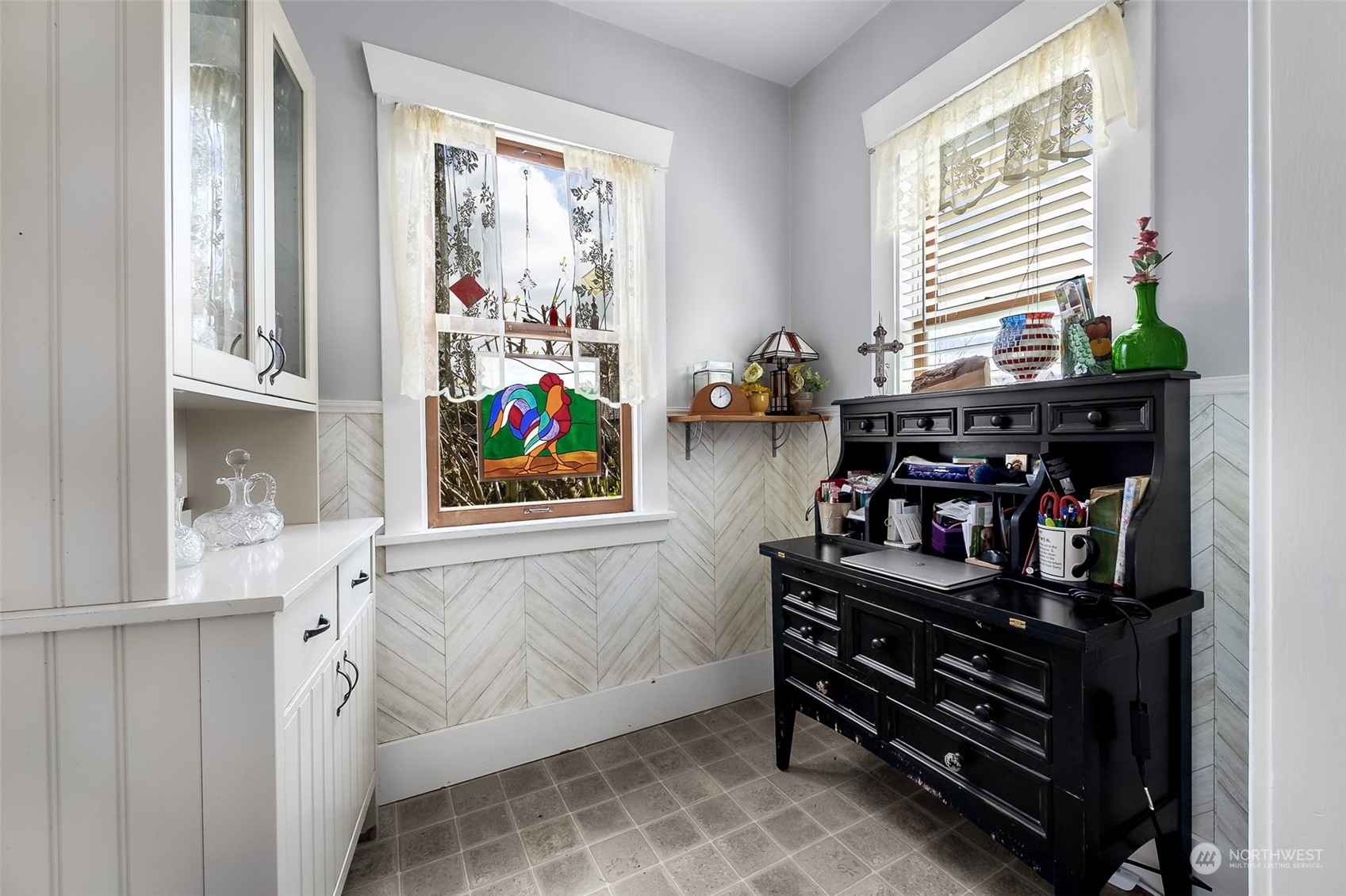 222 Wells Avenue North Renton, WA 98057 - Photo 14 of 23 a view of a workspace with furniture and a window