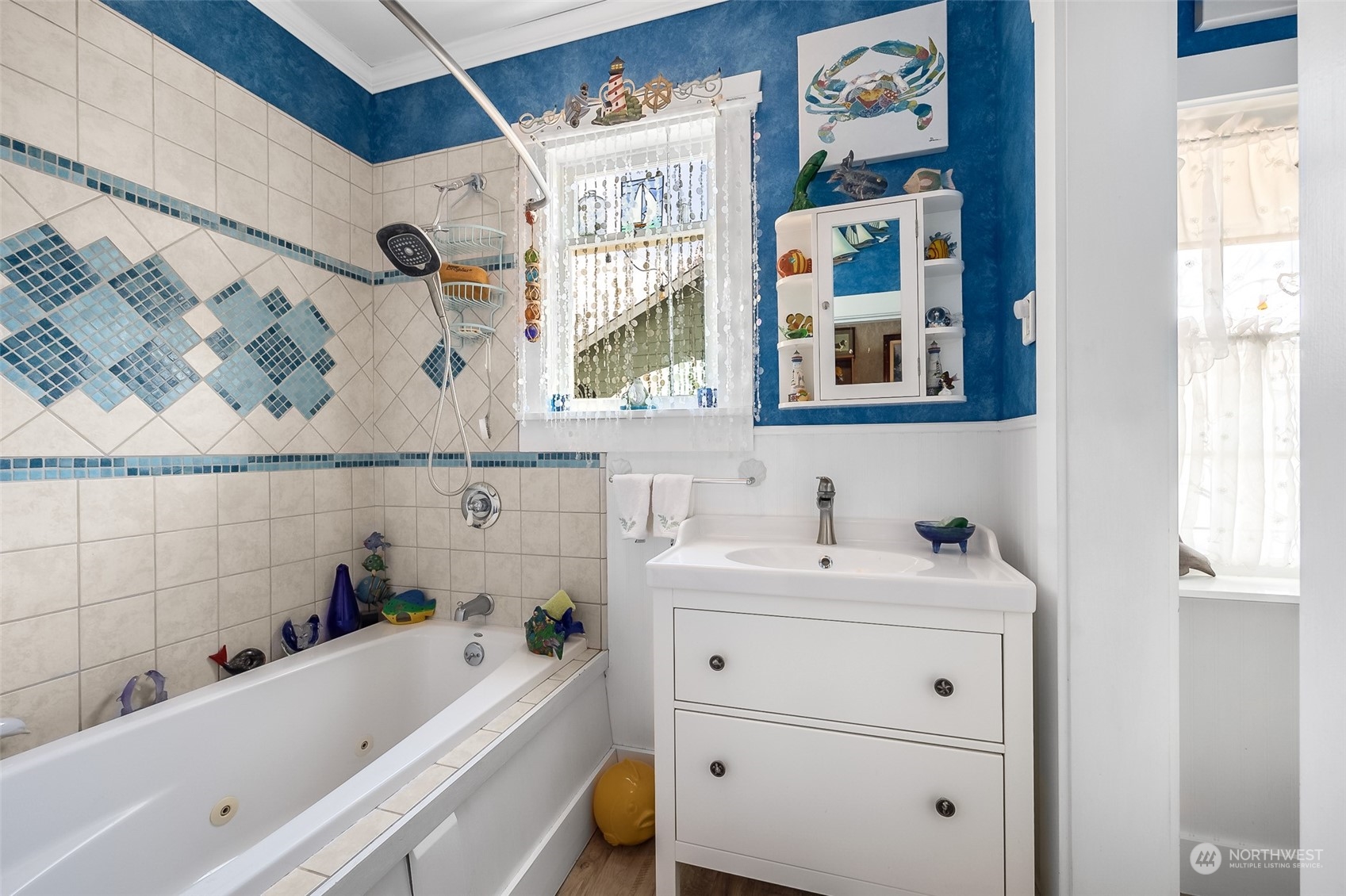 222 Wells Avenue North Renton, WA 98057 - Photo 17 of 23 a bathroom with a tub sink and mirror