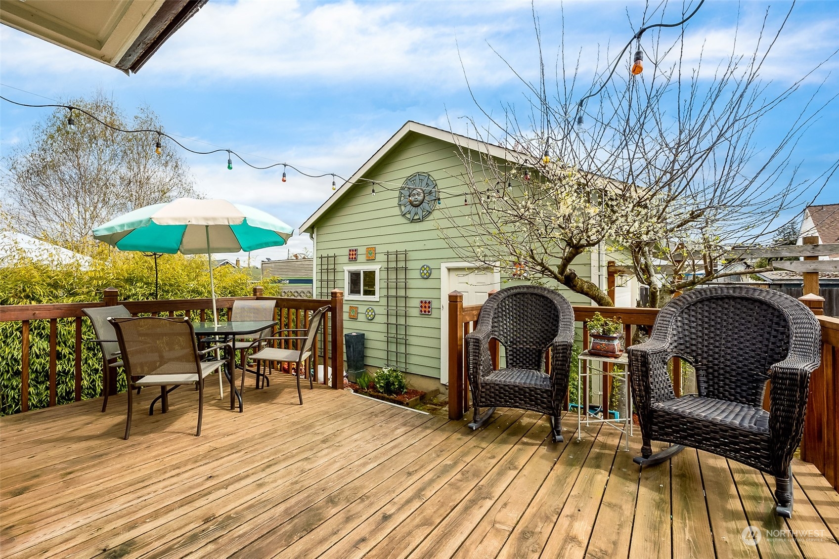 222 Wells Avenue North Renton, WA 98057 - Photo 7 of 23 a view of a dinning tables and chairs in the patio