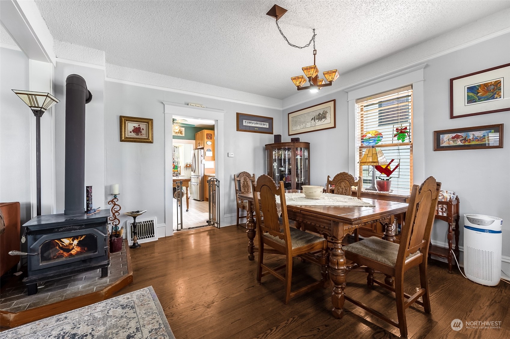 222 Wells Avenue North Renton, WA 98057 - Photo 10 of 23 a view of a dining room with furniture window and wooden floor